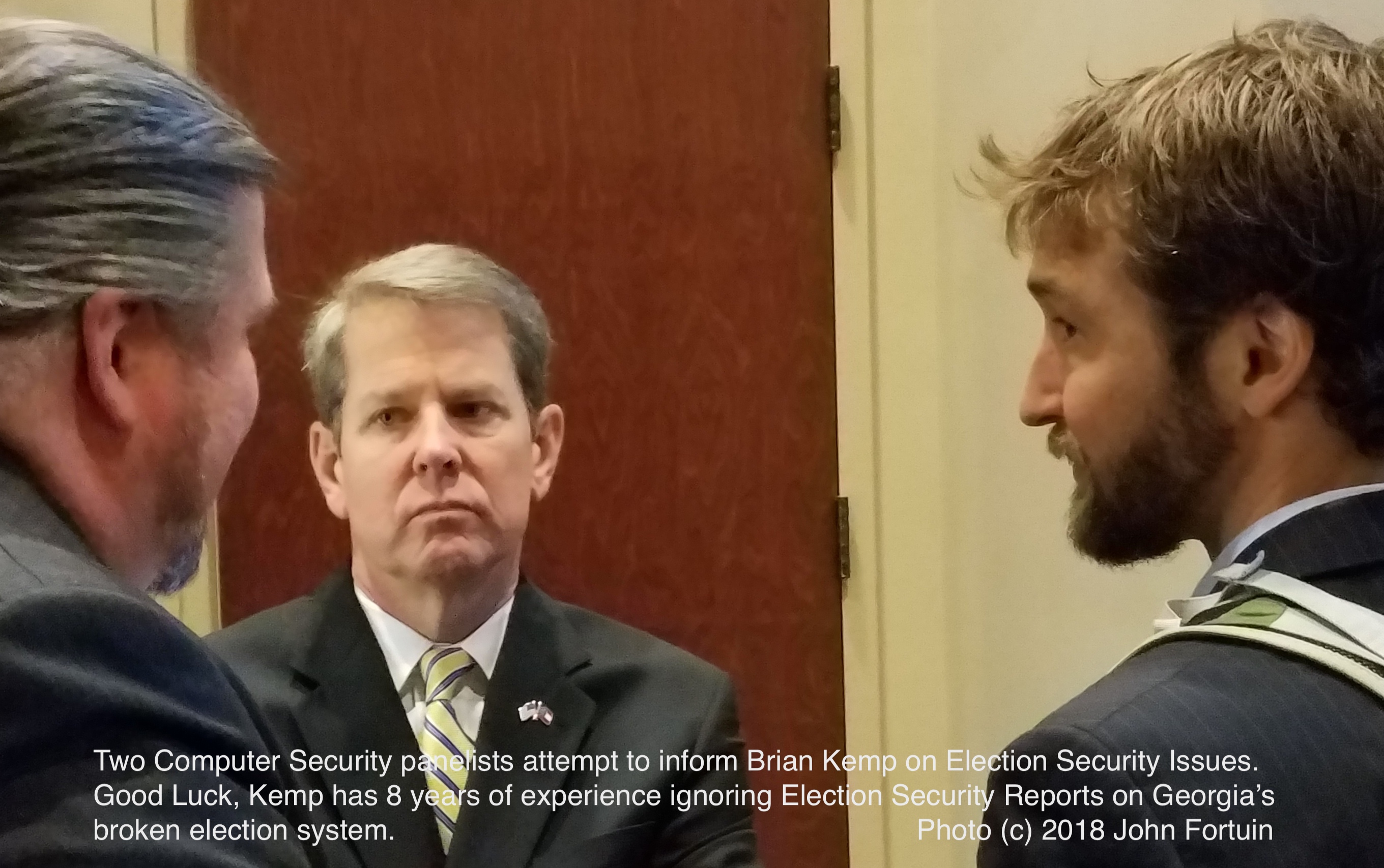 Brian Kemp feigns interest in election security with computer security experts.  Photo (c) 2018 John Fortuin